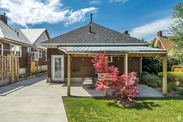1381 E 1300 S, Salt Lake City, UT 84105 - back of property featuring a patio area, brick siding, and roof with shingles