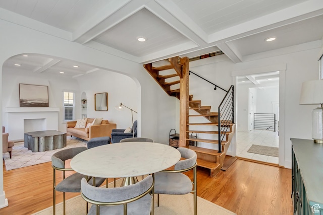 1381 E 1300 S, Salt Lake City, UT 84105 - dining space with light wood-type flooring, arched walkways, coffered ceiling, stairway, and beam ceiling