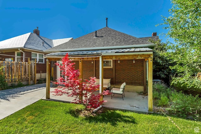 1381 E 1300 S, Salt Lake City, UT 84105 - rear view of property featuring a patio area, brick siding, roof with shingles, and a chimney