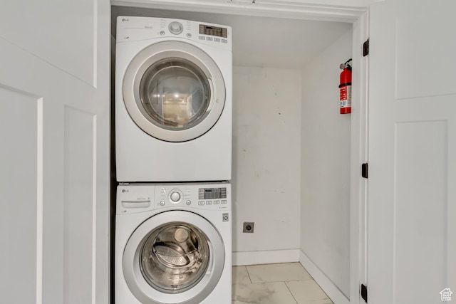 1381 E 1300 S, Salt Lake City, UT 84105 - laundry area featuring stacked washer and clothes dryer and baseboards