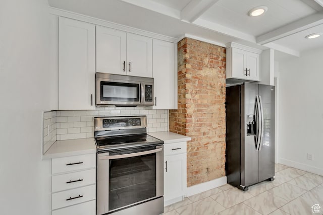 1381 E 1300 S, Salt Lake City, UT 84105 - kitchen with appliances with stainless steel finishes, beam ceiling, light countertops, decorative backsplash, and white cabinets