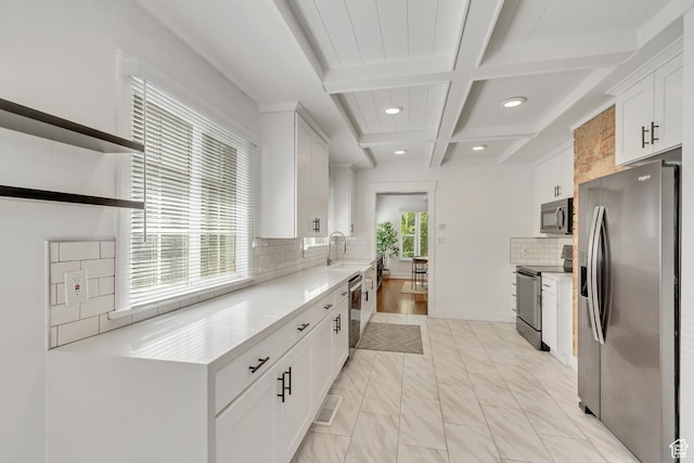1381 E 1300 S, Salt Lake City, UT 84105 - kitchen with stainless steel appliances, white cabinetry, decorative backsplash, beam ceiling, and coffered ceiling