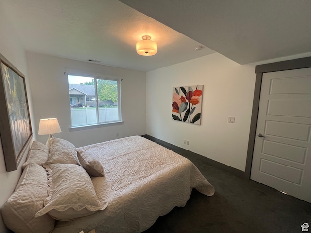 10337 S Wapati Moon Pl, South Jordan, UT 84095 - bedroom with dark colored carpet and baseboards