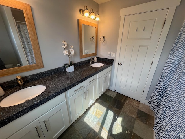 10337 S Wapati Moon Pl, South Jordan, UT 84095 - full bath featuring double vanity and stone finish flooring