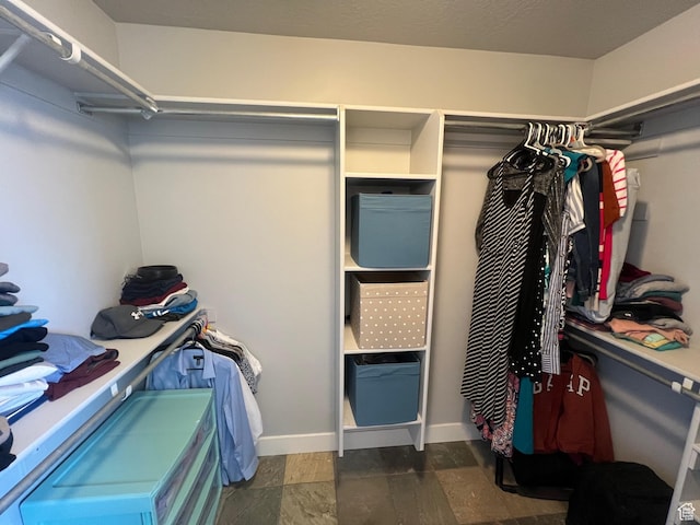 10337 S Wapati Moon Pl, South Jordan, UT 84095 - walk in closet featuring stone finish floors