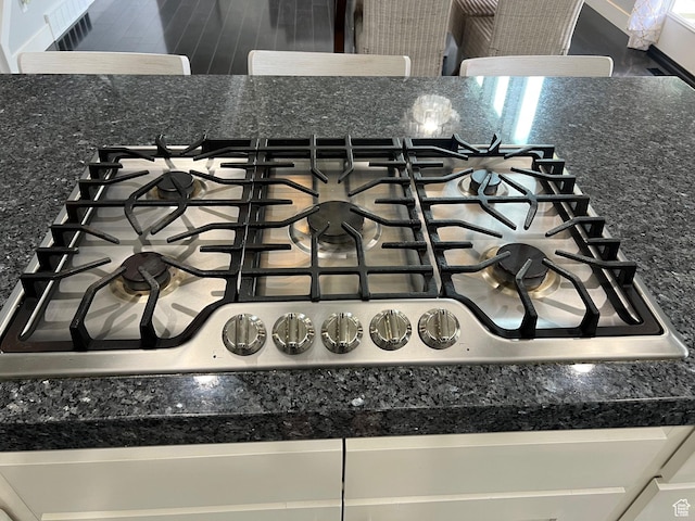 10337 S Wapati Moon Pl, South Jordan, UT 84095 - kitchen view of stainless steel gas cooktop and dark countertops