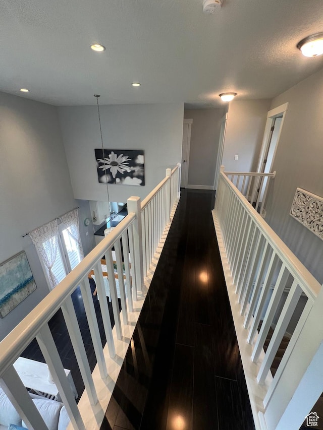 10337 S Wapati Moon Pl, South Jordan, UT 84095 - hall with an upstairs landing, wood finished floors, and recessed lighting