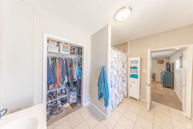 525 3rd St, Ogden, UT 84404 - bathroom with tile patterned floors, curtained shower, and a spacious closet