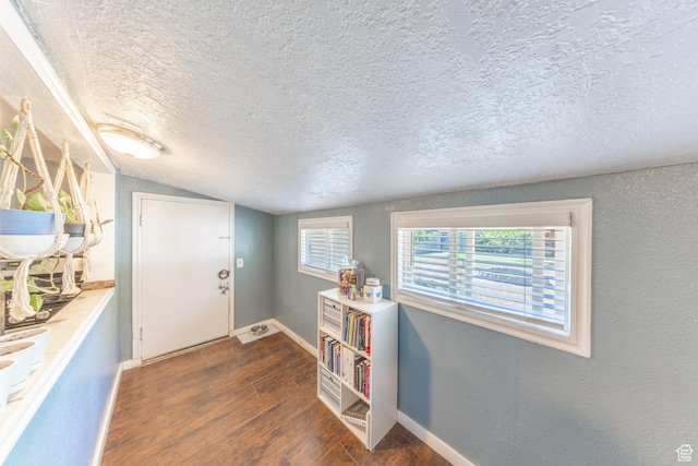 525 3rd St, Ogden, UT 84404 - entrance foyer with a textured ceiling, wood finished floors, lofted ceiling, and a textured wall