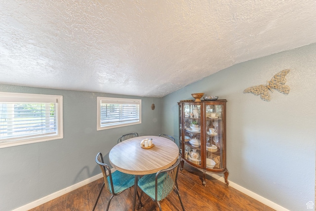 525 3rd St, Ogden, UT 84404 - dining area with a textured ceiling, wood finished floors, and vaulted ceiling