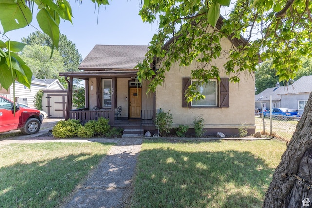 525 3rd St, Ogden, UT 84404 - view of front facade featuring covered porch, roof with shingles, and stucco siding