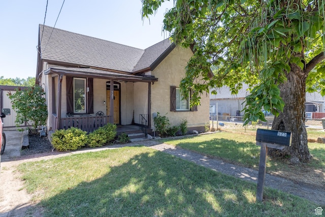525 3rd St, Ogden, UT 84404 - view of front of property featuring a porch, stucco siding, and roof with shingles