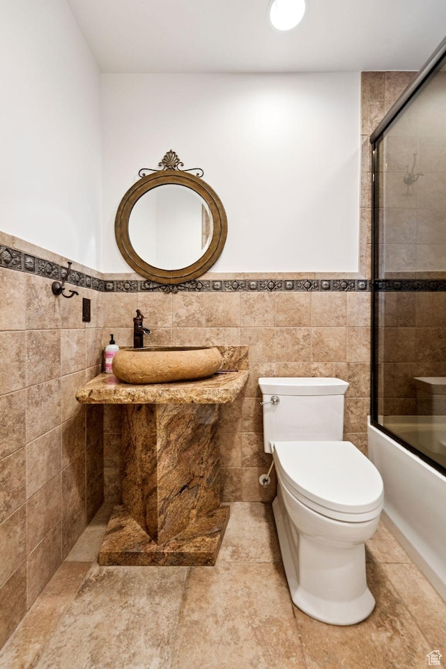4307 Churchill Dr N Unit 97, Provo, UT 84604 - bathroom with tile walls, enclosed tub / shower combo, and a wainscoted wall