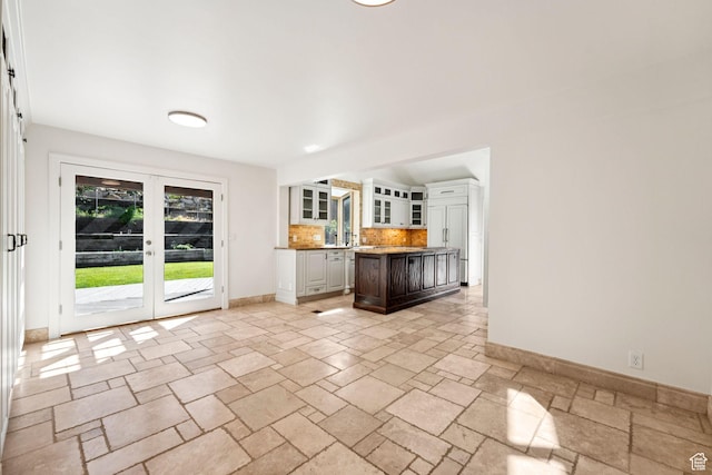 4307 Churchill Dr N Unit 97, Provo, UT 84604 - unfurnished living room with baseboards and stone tile floors