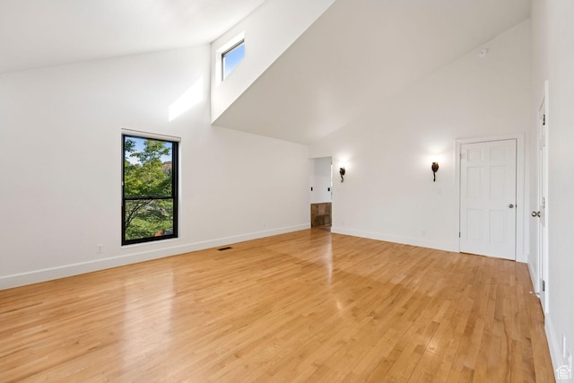 4307 Churchill Dr N Unit 97, Provo, UT 84604 - spare room featuring high vaulted ceiling, healthy amount of natural light, and light wood-style floors