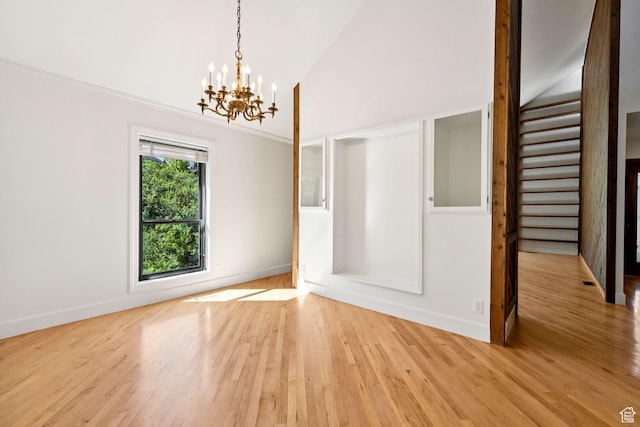4307 Churchill Dr N Unit 97, Provo, UT 84604 - unfurnished dining area with a chandelier, light wood-style flooring, and high vaulted ceiling