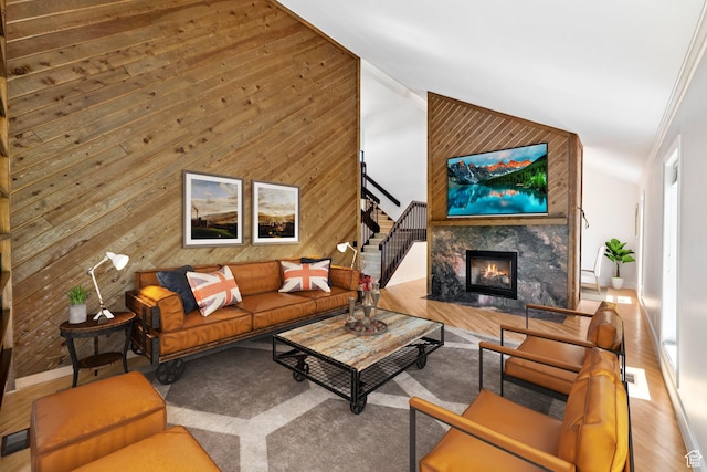4307 Churchill Dr N Unit 97, Provo, UT 84604 - living area with stairs, a fireplace, wooden walls, high vaulted ceiling, and wood finished floors