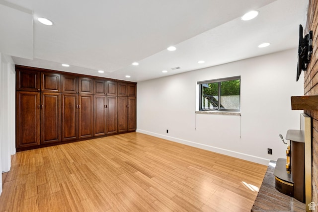 4307 Churchill Dr N Unit 97, Provo, UT 84604 - unfurnished living room with light wood finished floors, recessed lighting, and a fireplace