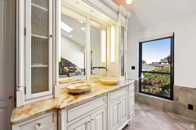 4307 Churchill Dr N Unit 97, Provo, UT 84604 - bathroom featuring vanity, a skylight, and tile patterned floors