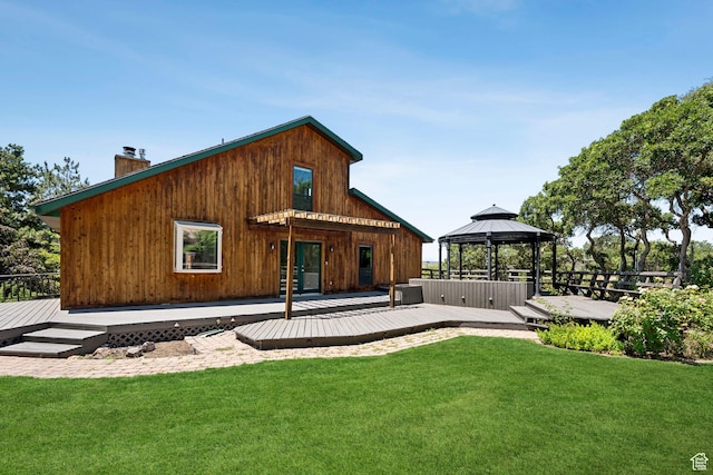 4307 Churchill Dr N Unit 97, Provo, UT 84604 - rear view of house with a gazebo, a chimney, a deck, and a lawn
