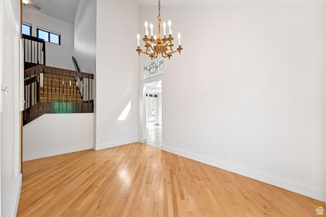 4307 Churchill Dr N Unit 97, Provo, UT 84604 - entrance foyer featuring wood finished floors, a chandelier, and stairs