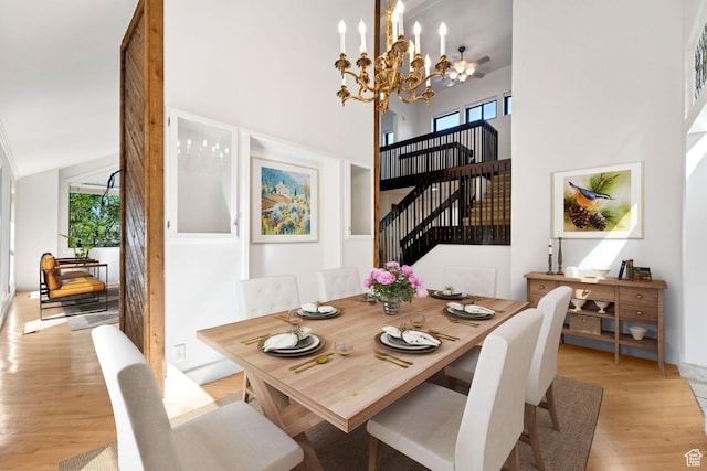 4307 Churchill Dr N Unit 97, Provo, UT 84604 - dining area with a chandelier, light wood-type flooring, and a high ceiling