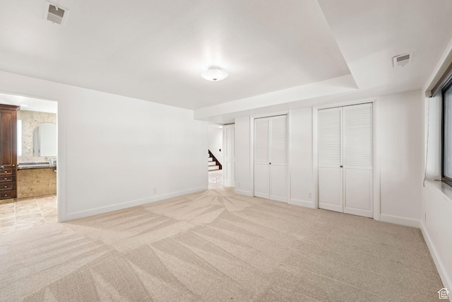 4307 Churchill Dr N Unit 97, Provo, UT 84604 - unfurnished bedroom with light colored carpet, multiple closets, and connected bathroom