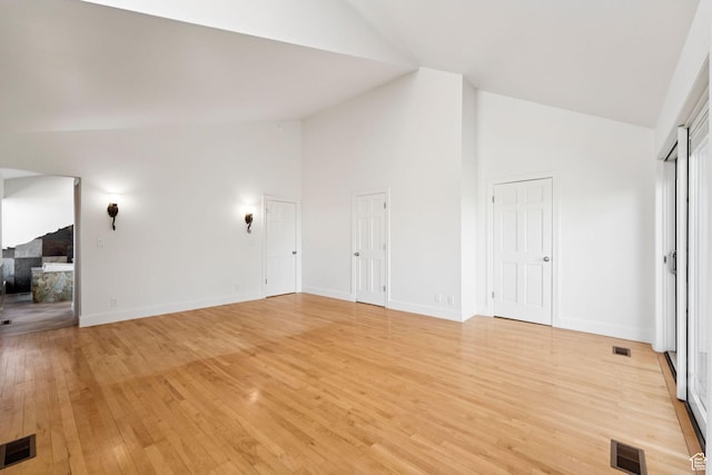 4307 Churchill Dr N Unit 97, Provo, UT 84604 - unfurnished living room with high vaulted ceiling and light wood-style floors