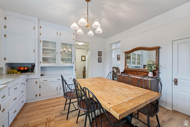 266 W 200 S, Hurricane, UT 84737 - dining room featuring light wood-type flooring and a chandelier