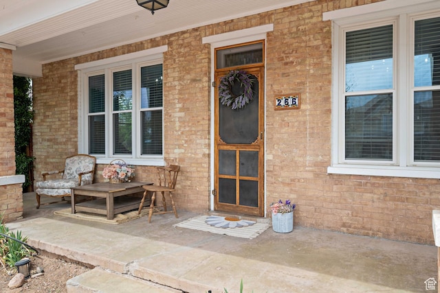 266 W 200 S, Hurricane, UT 84737 - doorway to property featuring a porch and brick siding