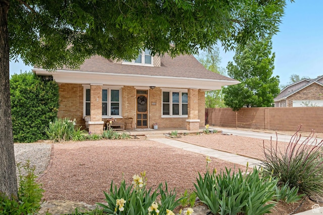 266 W 200 S, Hurricane, UT 84737 - view of front facade with a porch, brick siding, and roof with shingles