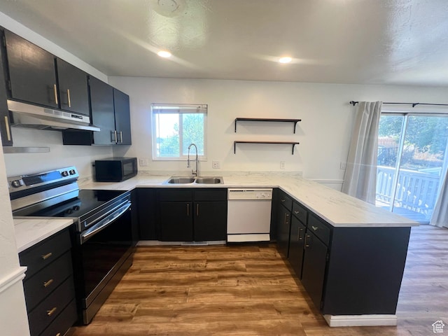 1128 W 600 N, Orem, UT 84057 - kitchen featuring white dishwasher, stainless steel range with electric cooktop, under cabinet range hood, a peninsula, and black microwave