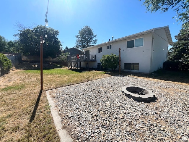 1128 W 600 N, Orem, UT 84057 - back of house with a fire pit, a wooden deck, stucco siding, and stairway