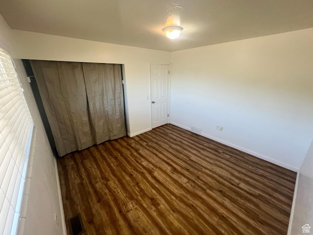 1128 W 600 N, Orem, UT 84057 - unfurnished bedroom with dark wood-style flooring and a closet