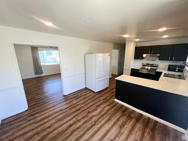 1128 W 600 N, Orem, UT 84057 - kitchen with freestanding refrigerator, electric range, dark cabinetry, light countertops, and dark wood-style floors