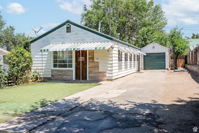 175 S 200 E, Payson, UT 84651 - bungalow with an outbuilding, a garage, stone siding, and driveway