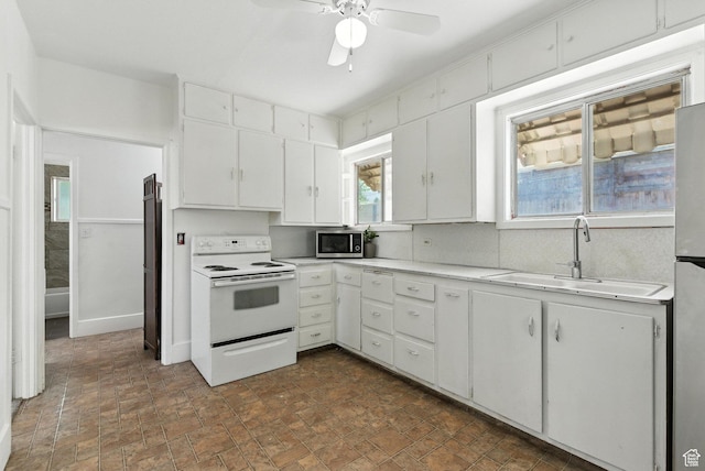 175 S 200 E, Payson, UT 84651 - kitchen featuring stainless steel appliances, light countertops, white cabinetry, and ceiling fan