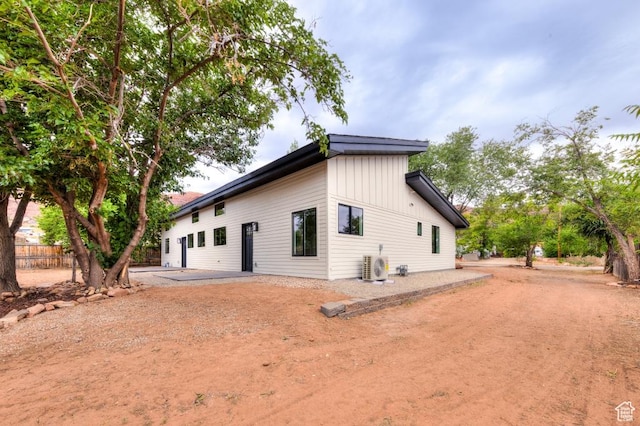 1191 Wagner Ave, Moab, UT 84532 - view of home's exterior with board and batten siding and a patio