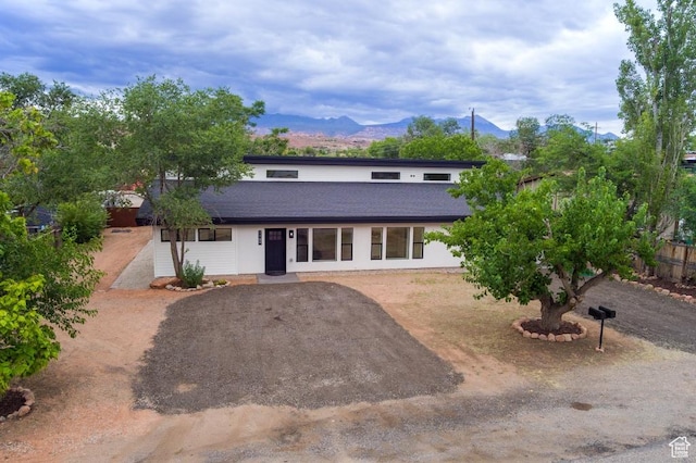 1191 Wagner Ave, Moab, UT 84532 - view of front of property featuring a shingled roof and a mountain view