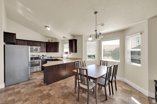 8264 S Resaca Dr Unit K9, Sandy, UT 84070 - kitchen featuring appliances with stainless steel finishes, dark brown cabinetry, a peninsula, a chandelier, and stone finish flooring