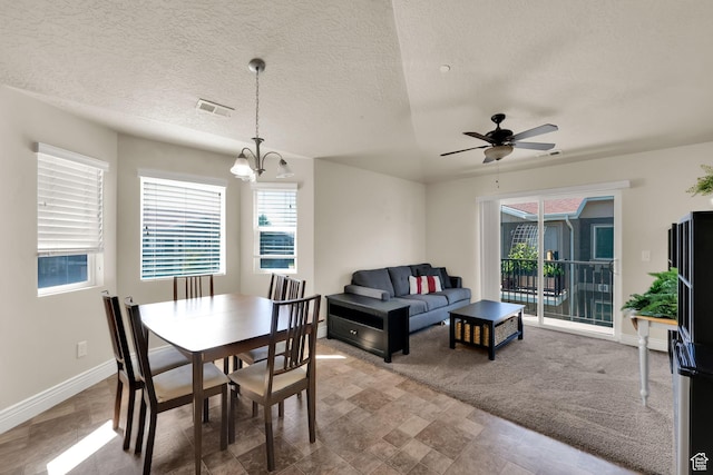 8264 S Resaca Dr Unit K9, Sandy, UT 84070 - dining space with plenty of natural light, a chandelier, a ceiling fan, and a textured ceiling