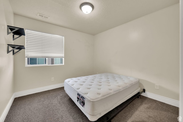 8264 S Resaca Dr Unit K9, Sandy, UT 84070 - bedroom featuring carpet floors and a textured ceiling