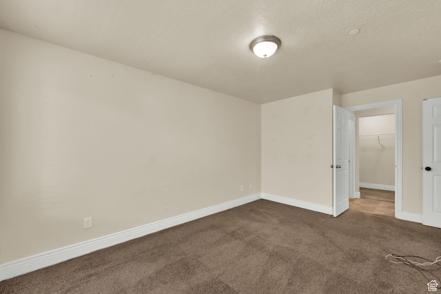 8264 S Resaca Dr Unit K9, Sandy, UT 84070 - unfurnished room with carpet floors and a textured ceiling