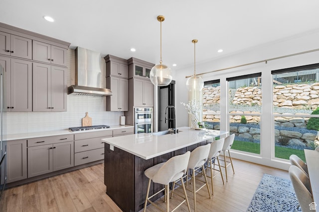 5488 N Valley Rd E, Lehi, UT 84043 - kitchen with wall chimney exhaust hood, gray cabinets, stainless steel appliances, backsplash, and recessed lighting