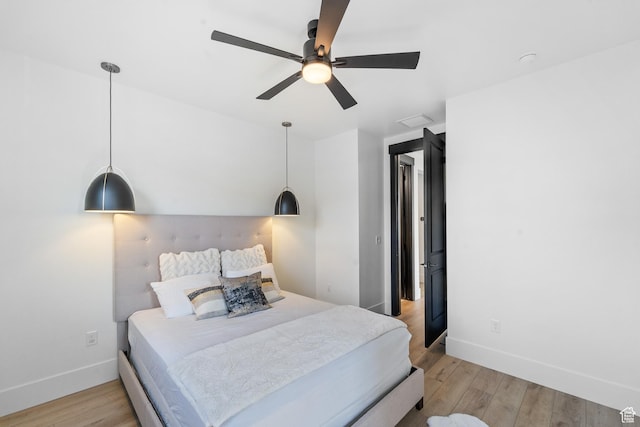 5488 N Valley Rd E, Lehi, UT 84043 - bedroom with light wood-type flooring and a ceiling fan