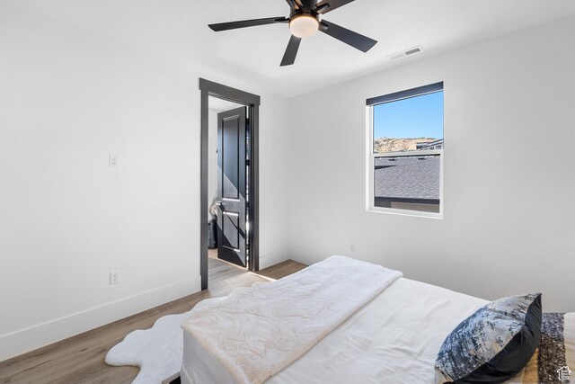 5488 N Valley Rd E, Lehi, UT 84043 - bedroom with wood finished floors and ceiling fan