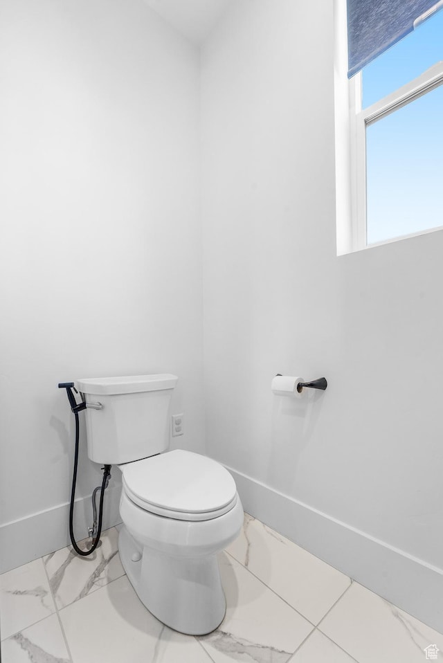 5488 N Valley Rd E, Lehi, UT 84043 - bathroom with marble look tile flooring and toilet