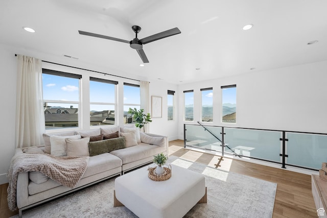 5488 N Valley Rd E, Lehi, UT 84043 - living area with light wood finished floors, a ceiling fan, and recessed lighting
