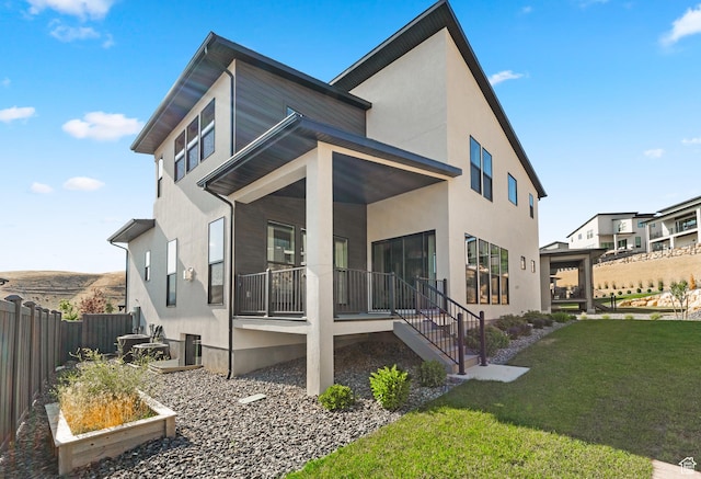 5488 N Valley Rd E, Lehi, UT 84043 - back of house with a porch and stucco siding