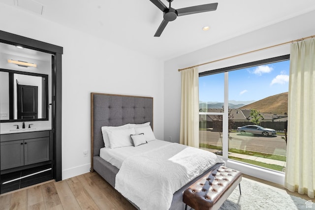 5488 N Valley Rd E, Lehi, UT 84043 - bedroom featuring light wood-style floors, a mountain view, recessed lighting, and a ceiling fan